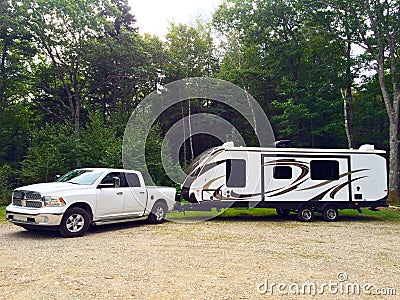 Travel trailer with white pick up truck rest Stock Photo