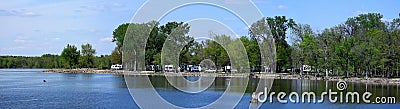 Travel trailers camping by the Mississippi river in Illinois at Thomson Causway panorama Editorial Stock Photo