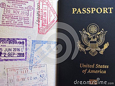 Travel or turism concept. American passport. Opened passport with visa stamps. Editorial Stock Photo