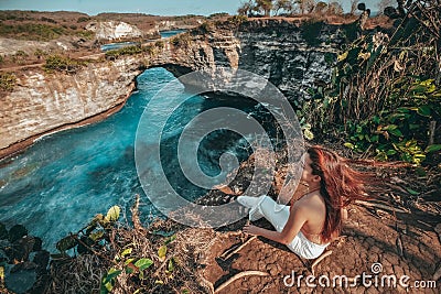 Travel woman looking view of broken beach, Nusa Penida island Bali ,Indonesia Stock Photo
