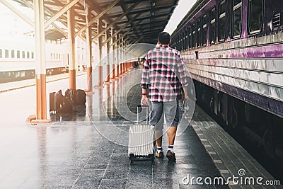 Traveler with baggage and map in train station. Travel concept Stock Photo