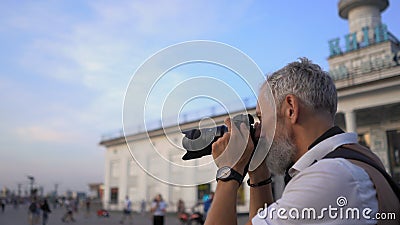 The Traveler With The Camera Is Going To Take The Best Pictures Of The City For The Report. Stock Photo