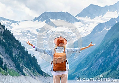 The traveler enjoys the view of the mountain valley.. Travel and active life concept. Stock Photo