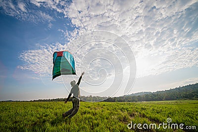 Traveler having camping with a tent on grass field and wind blow tent away Stock Photo