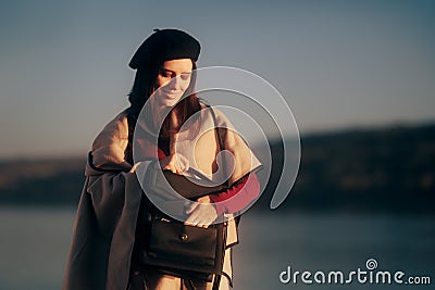 Travel Woman checking her Purse for Papers in a Harbor Stock Photo