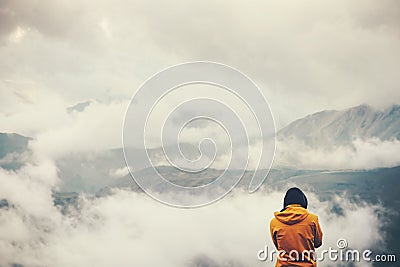 Traveler hiking enjoy cloudy foggy mountains landscape Stock Photo