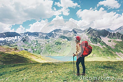 Traveler hiking in mountains enjoying lake view Travel Lifestyle adventure concept happy emotions summer vacations outdoor Stock Photo