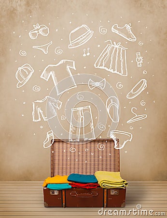 Traveler luggage with hand drawn clothes and icons Stock Photo