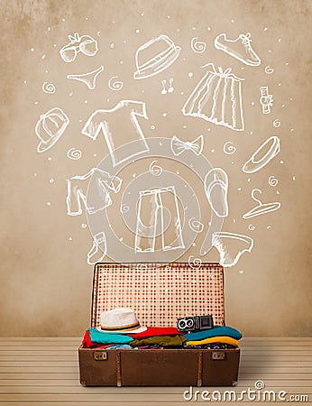 Traveler luggage with hand drawn clothes and icons Stock Photo