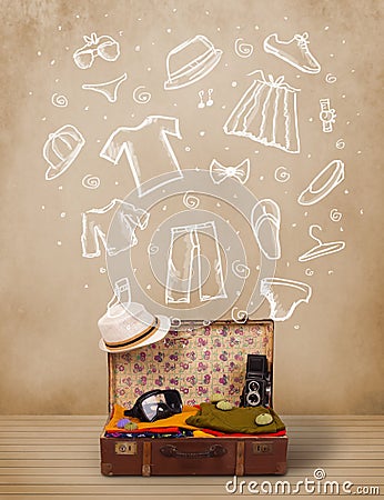 Traveler luggage with hand drawn clothes and icons Stock Photo