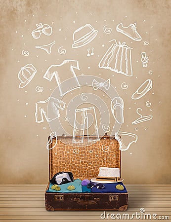 Traveler luggage with hand drawn clothes and icons Stock Photo