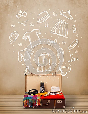 Traveler luggage with hand drawn clothes and icons Stock Photo