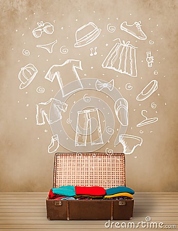 Traveler luggage with hand drawn clothes and icons Stock Photo