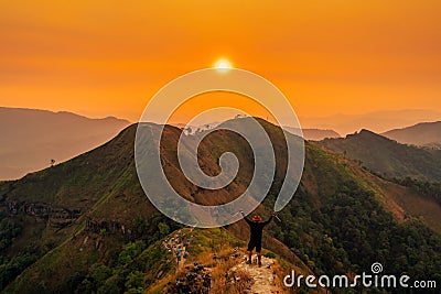Traveler man hiking enjoying in the mountains with backpack at Khao Chang Puak mountain Thailand Editorial Stock Photo