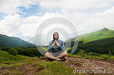 Traveler man relaxing meditation with serene view mountains Stock Photo