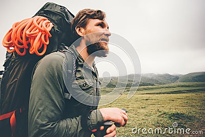 Traveler Man wayfaring in foggy mountains Stock Photo