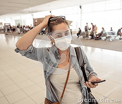Traveler with mask stuck in airport no able to return home country due to COVID-19 border closures Stock Photo