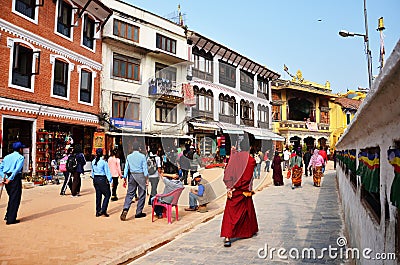 Traveler and Nepalese people on Street of Boudhanath temple go to Bodnath Stupa for pray in Kathmandu. Editorial Stock Photo