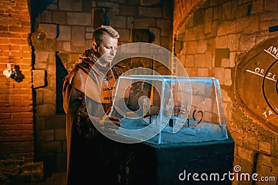 Traveler solving ancient puzzles in the dungeon Stock Photo