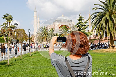 a traveler takes a photo in Istanbul in front of a large mosque Stock Photo