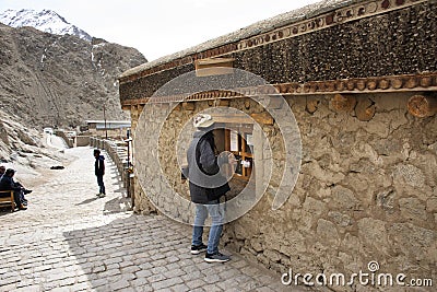 Traveler thai women buy ticket from indian and tibetan people at tickets box for travel visit in Leh Stok Monastery or Gompa Editorial Stock Photo