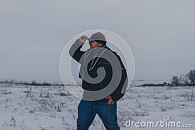 Traveler walking in a winter steppe Stock Photo