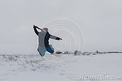 Traveler walking in a winter steppe Stock Photo