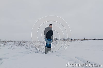 Traveler walking in a winter steppe Stock Photo