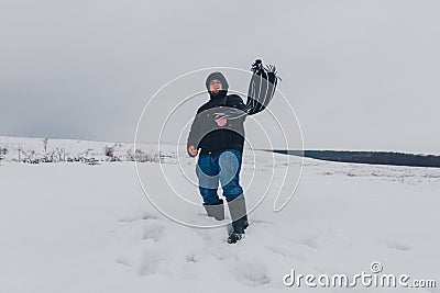 Traveler walking in a winter steppe Stock Photo