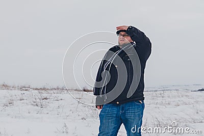 Traveler walking in a winter steppe Stock Photo