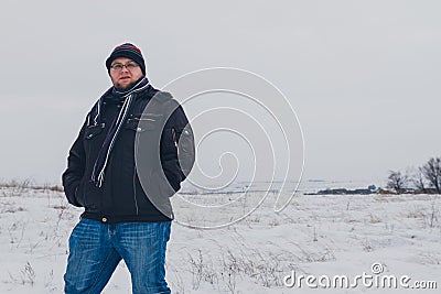 Traveler walking in a winter steppe Stock Photo