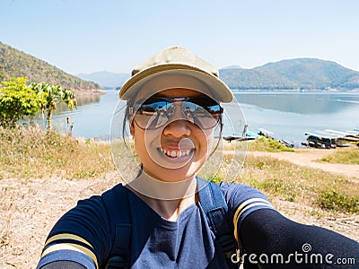 Traveler woman take picture by herself Stock Photo