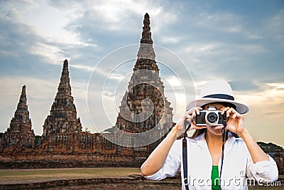 Traveler women covering her face with the camera Stock Photo