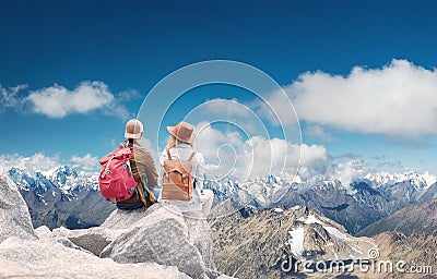 Travelers couple look at the mountains landscape. Travel and active life concept with team. Stock Photo