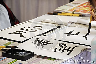 Travelers people join with use paintbrush writing japanese activity in Tanabata festival at Japan village in Ayutthaya, Thailand Editorial Stock Photo