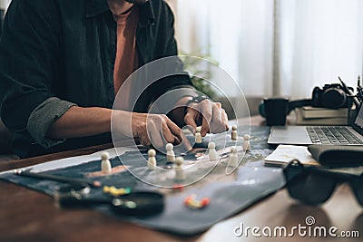 Travelers planning use small wood doll to marking on map and finger pointing on map, or find travel routes. Travel concept Stock Photo