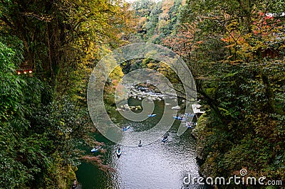 Travelers on a rowing boat at Takachiho Gorge in Kyushu Stock Photo