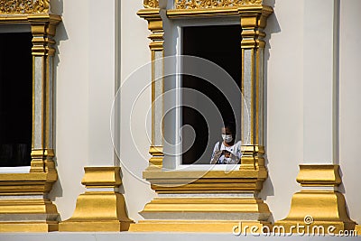 Travelers thai women people travel visit and respect praying buddha blessing holy worship in ancient architecture antique building Stock Photo