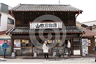 Thai women travel and portrait posing for take photo in Naritasan Omote Sando or Old Japanese Narita town at Chiba in Tokyo, Japan Editorial Stock Photo