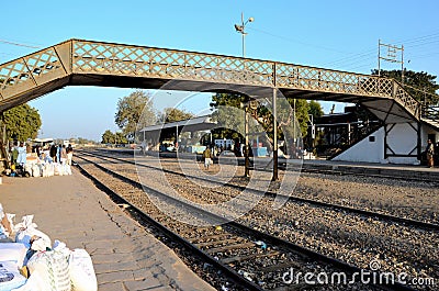 Travelers and traders wait with goods at train station platform Mirpurkhas Sindh Pakistan Editorial Stock Photo