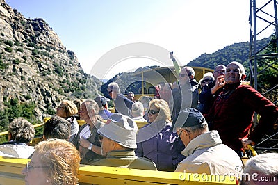 The travelers of the yellow train The little yellow train of the Pyrenees Editorial Stock Photo