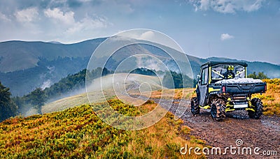 Traveling by all-terrain vehicle on the mountains. Off-road tour in Carpathian mountains, Ukraine, Europe. Editorial Stock Photo