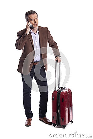 Traveling Businessman Calling for a Rideshare Stock Photo