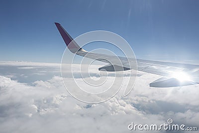 Traveling, flying by airplane, travel the world, with airplane above the clouds Stock Photo