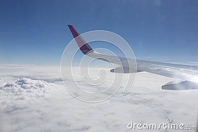 Traveling, flying by airplane, travel the world, with airplane above the clouds Stock Photo