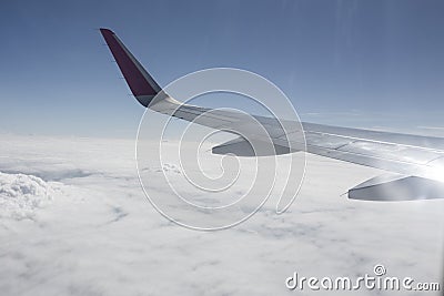 Traveling, flying by airplane, travel the world, with airplane above the clouds Stock Photo