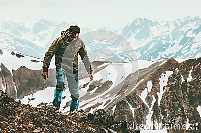 Traveling Man alone hiking in mountains Lifestyle survival concept Stock Photo