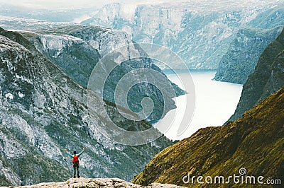 Traveling Man enjoying Naeroyfjord mountains landscape Stock Photo