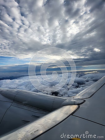 Traveling over the beautiful cloudy skies Stock Photo
