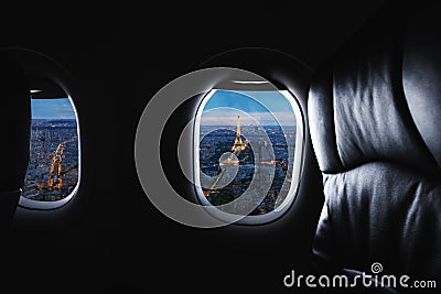 Traveling Paris, France famous landmark and travel destination in Europe. Aerial view Eiffel Tower through airplane window Editorial Stock Photo